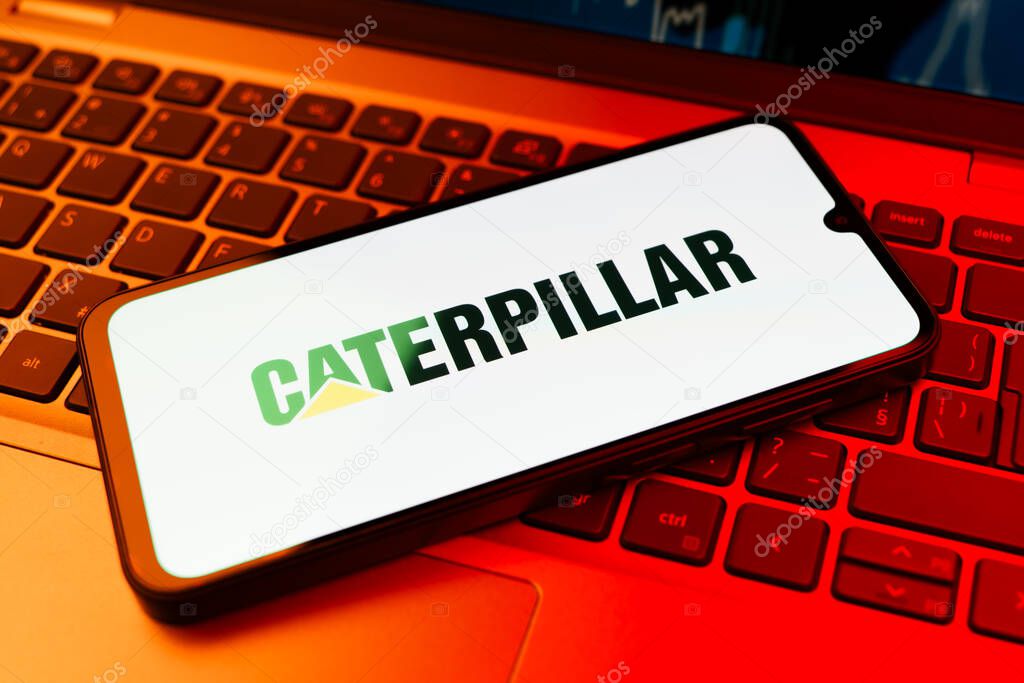 Prague, Czechia - 02 21 2025: Laptop on surface showing Caterpillar logo.