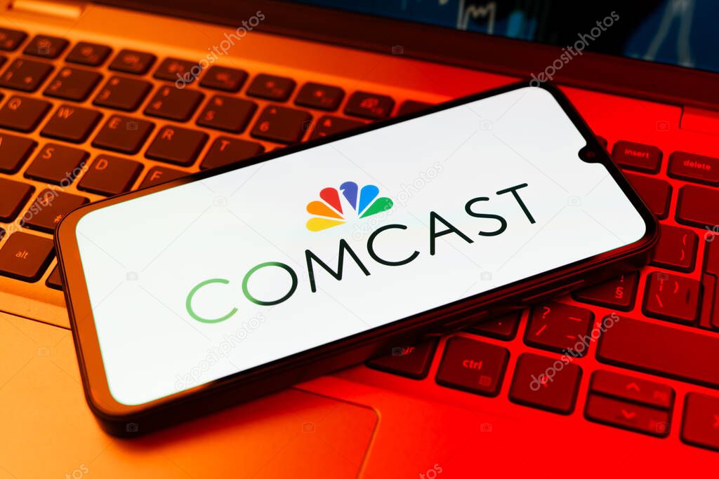 Prague, Czechia - 02 21 2025: Laptop on surface showing Comcast logo.