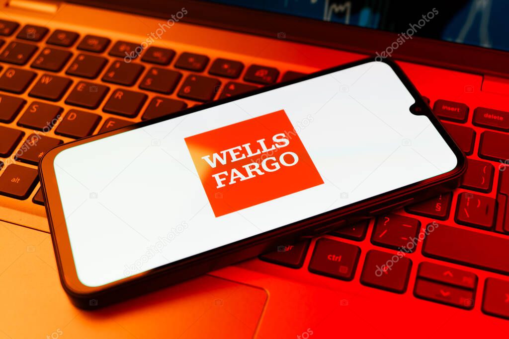 Prague, Czechia - 02 21 2025: Laptop on surface showing Wells Fargo logo.