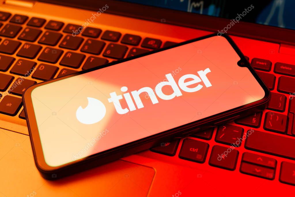 Prague, Czechia - 02 21 2025: Laptop on surface showing Tinder logo.