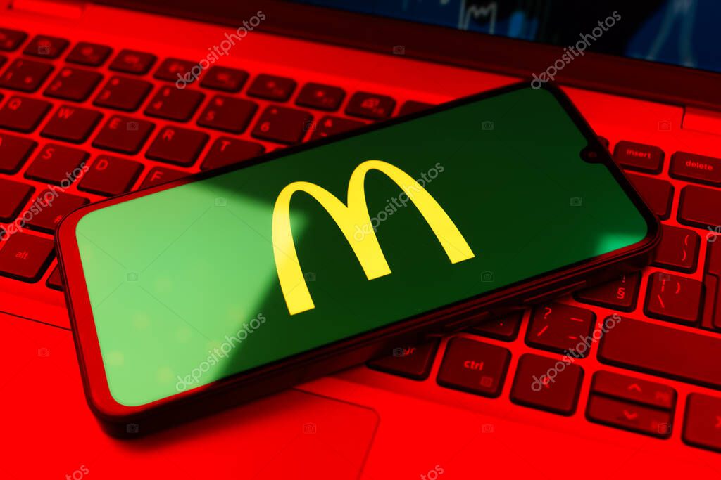 Prague, Czechia - 02 21 2025: Laptop on surface showing McDonalds logo.