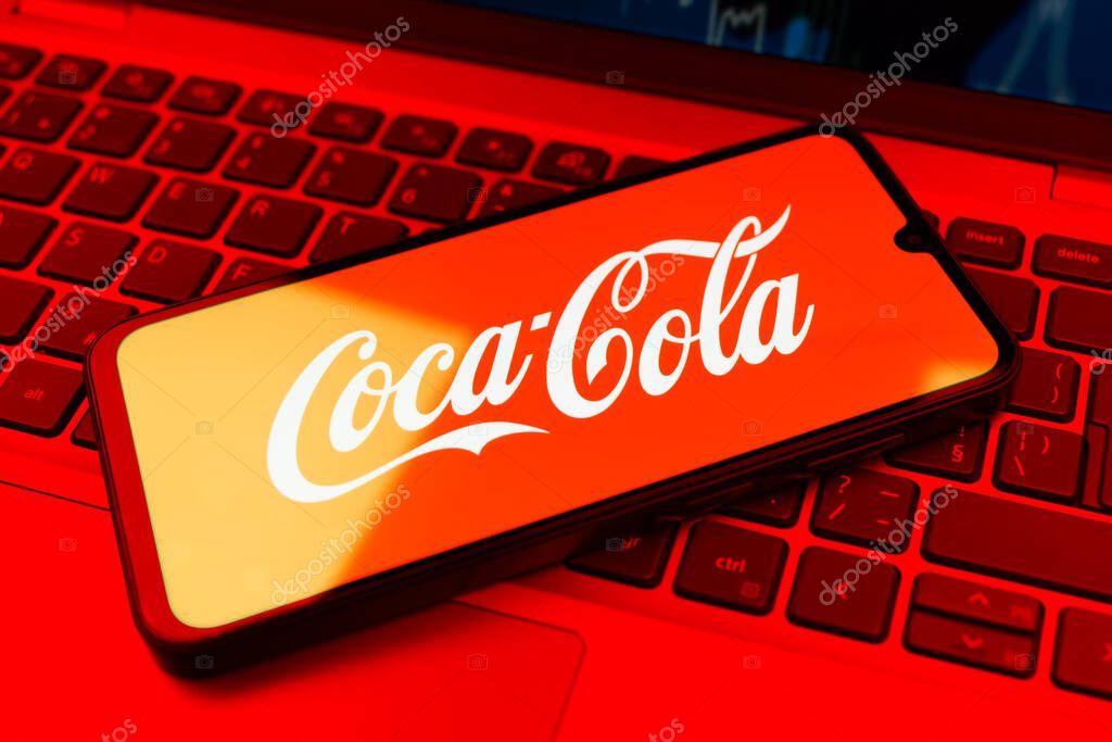 Prague, Czechia - 02 21 2025: Laptop on surface showing Coca-Cola logo.