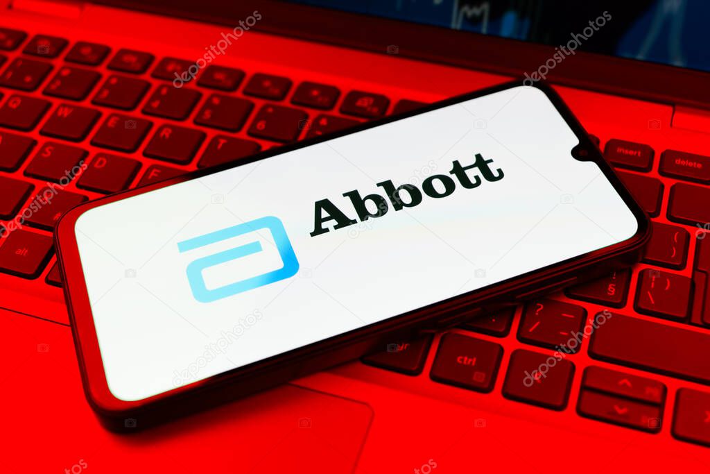 Prague, Czechia - 02 21 2025: Laptop on surface showing Abbott Laboratories logo.