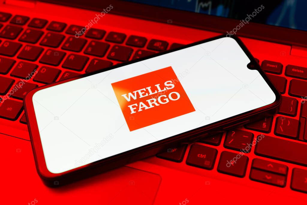 Prague, Czechia - 02 21 2025: Laptop on surface showing Wells Fargo logo.
