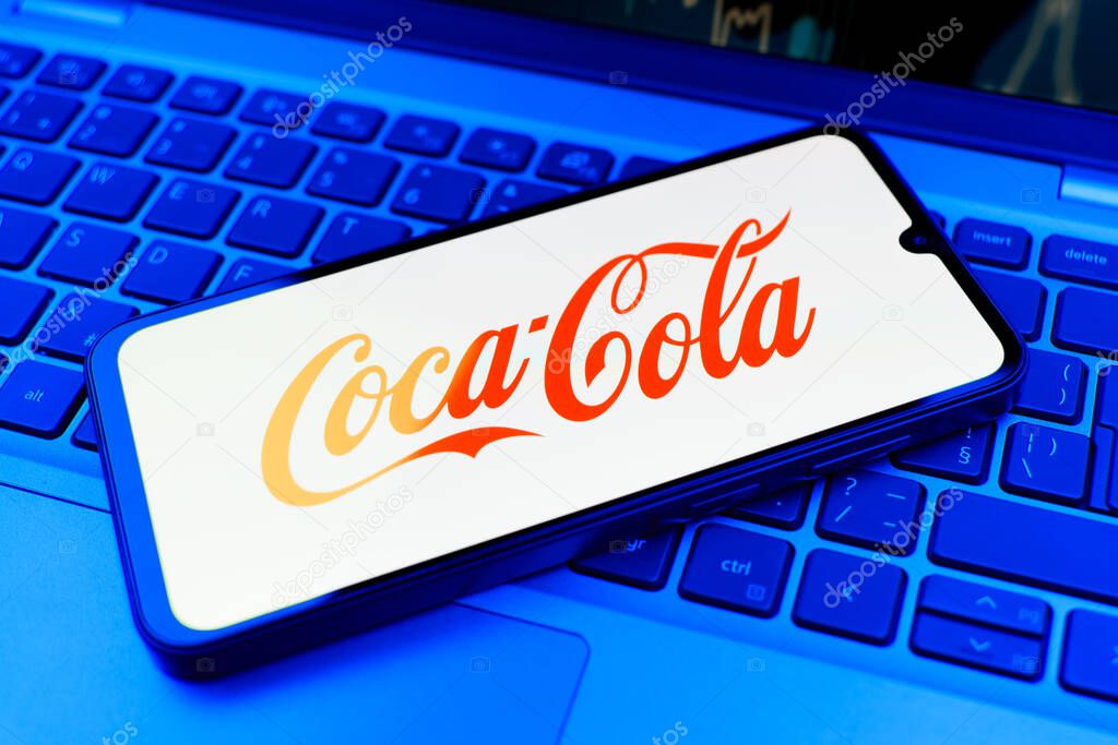 Prague, Czechia - 02 21 2025: Laptop on surface showing Coca-Cola logo.