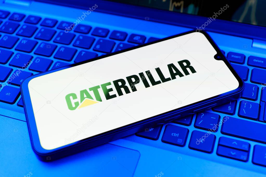 Prague, Czechia - 02 21 2025: Laptop on surface showing Caterpillar logo.