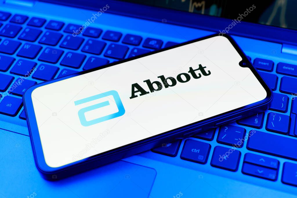 Prague, Czechia - 02 21 2025: Laptop on surface showing Abbott Laboratories logo.