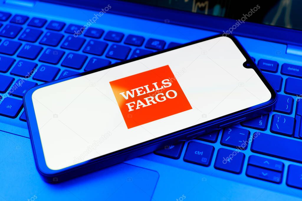 Prague, Czechia - 02 21 2025: Laptop on surface showing Wells Fargo logo.