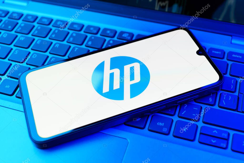 Prague, Czechia - 02 21 2025: Laptop on surface showing Hewlett-Packard logo.