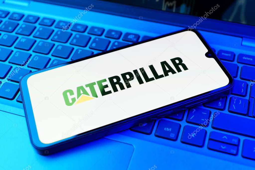 Prague, Czechia - 02 21 2025: Laptop on surface showing Caterpillar logo.