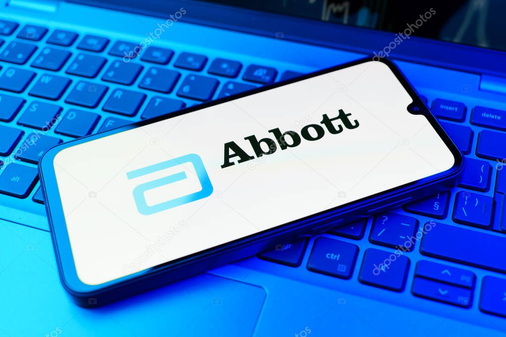 Prague, Czechia - 02 21 2025: Laptop on surface showing Abbott Laboratories logo.
