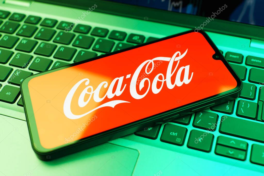 Prague, Czechia - 02 21 2025: Laptop on surface showing Coca-Cola logo.