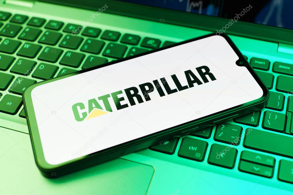 Prague, Czechia - 02 21 2025: Laptop on surface showing Caterpillar logo.