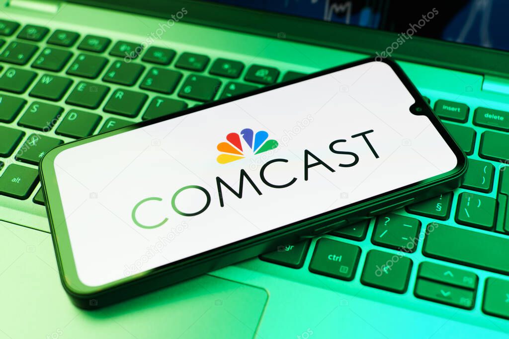 Prague, Czechia - 02 21 2025: Laptop on surface showing Comcast logo.