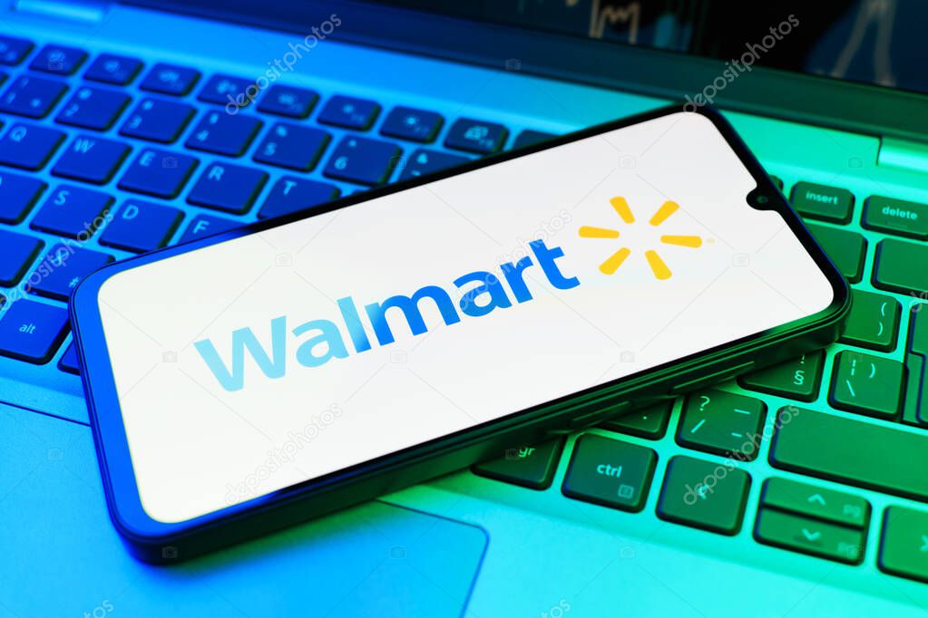 Prague, Czechia - 02 21 2025: Laptop on surface showing Walmart logo.