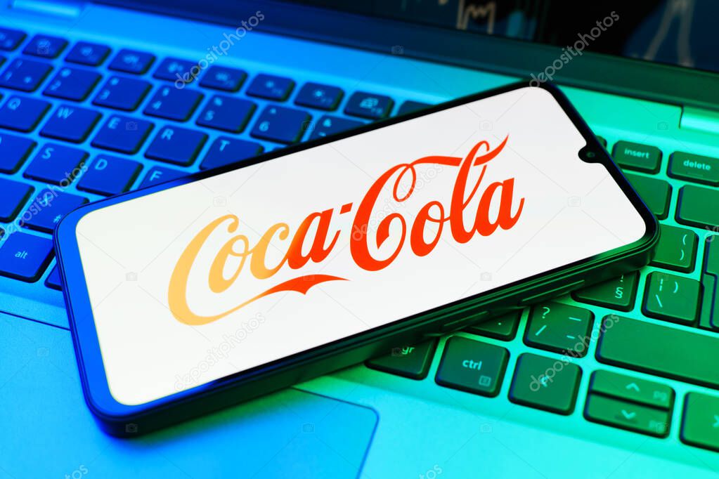 Prague, Czechia - 02 21 2025: Laptop on surface showing Coca-Cola logo.