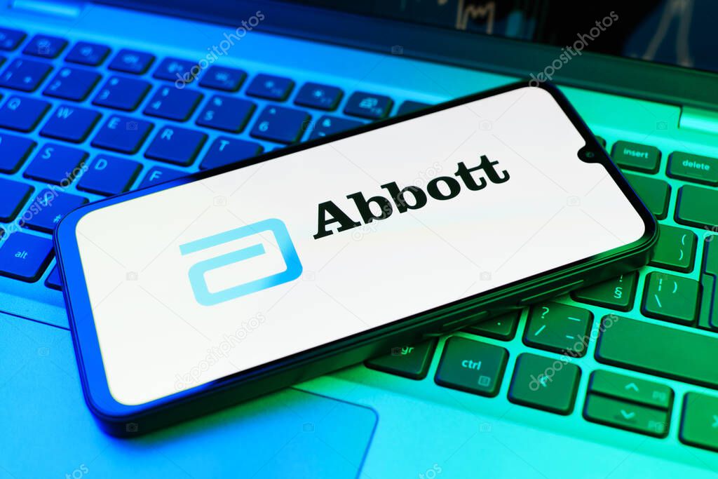 Prague, Czechia - 02 21 2025: Laptop on surface showing Abbott Laboratories logo.