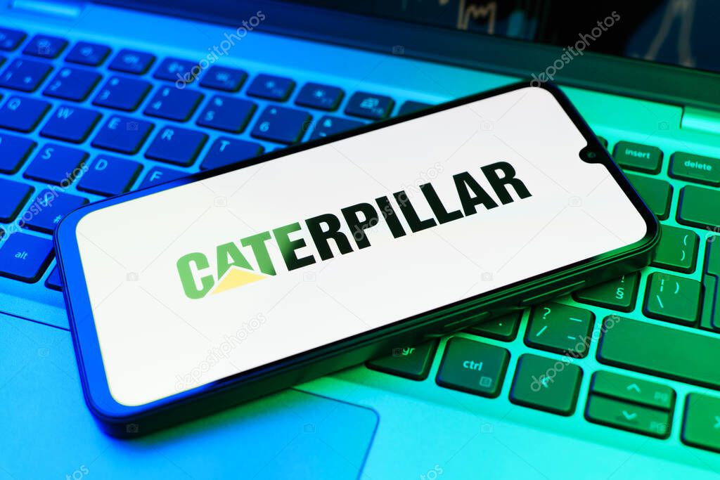 Prague, Czechia - 02 21 2025: Laptop on surface showing Caterpillar logo.