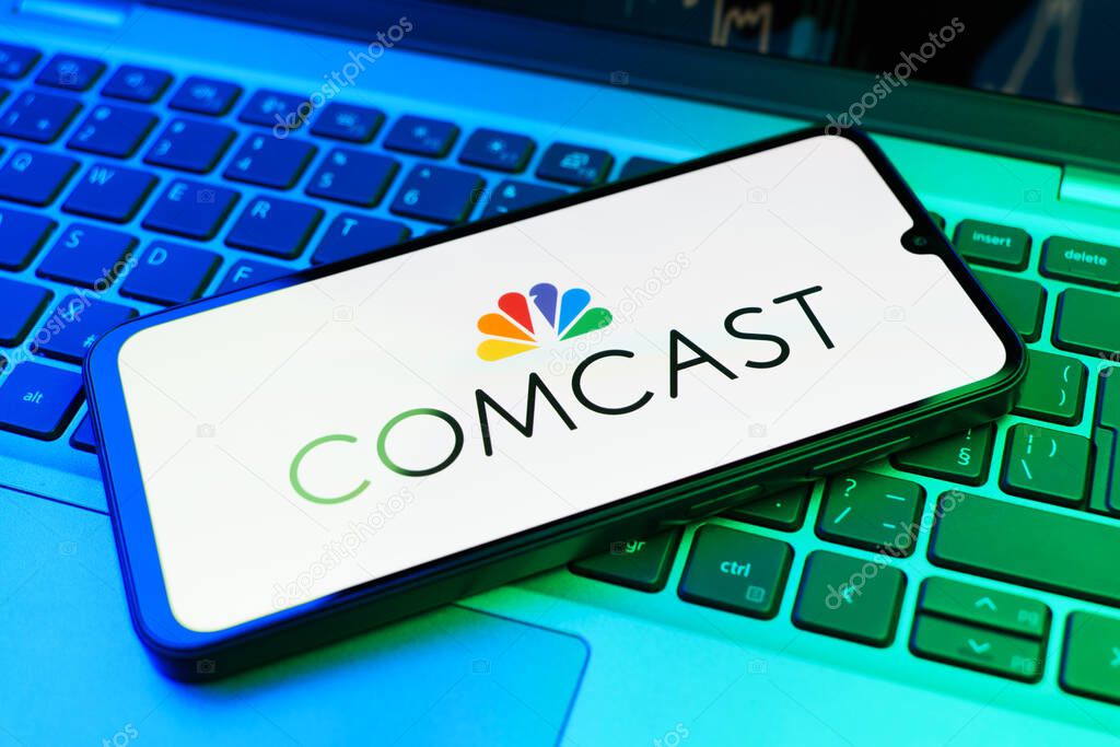 Prague, Czechia - 02 21 2025: Laptop on surface showing Comcast logo.