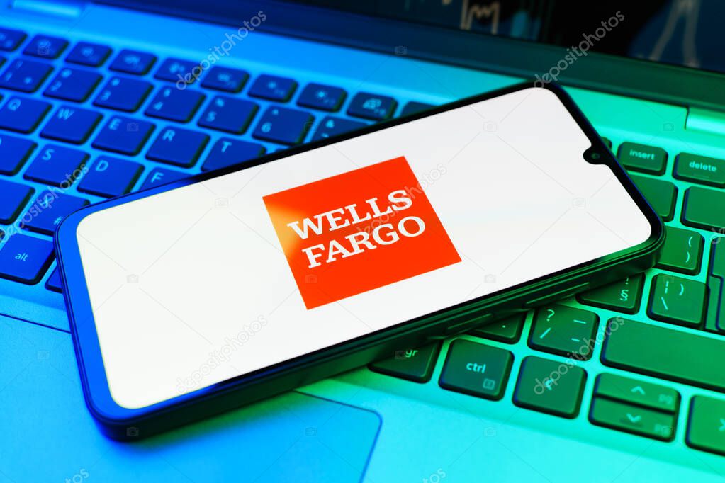 Prague, Czechia - 02 21 2025: Laptop on surface showing Wells Fargo logo.
