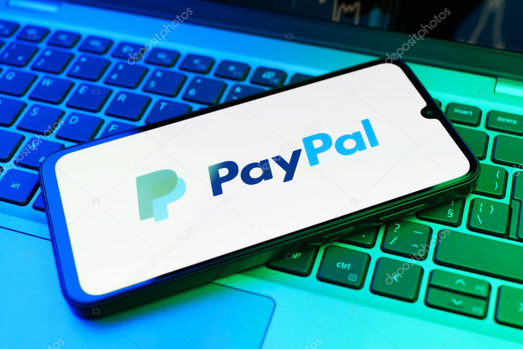 Prague, Czechia - 02 21 2025: Laptop on surface showing PayPal logo.