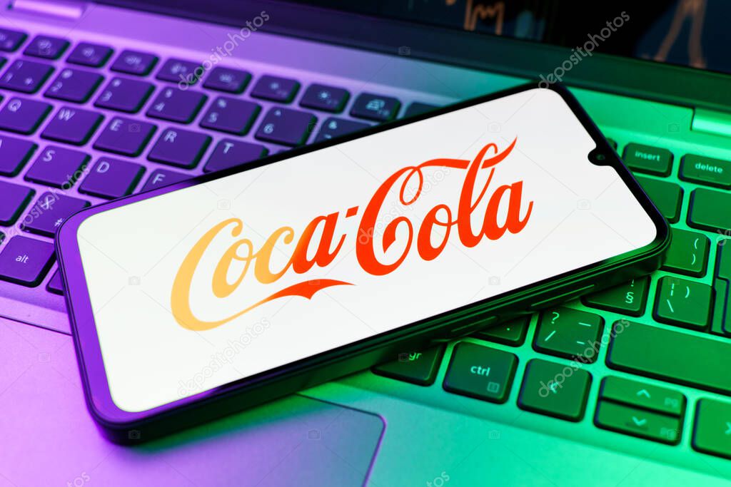 Prague, Czechia - 02 21 2025: Laptop on surface showing Coca-Cola logo.