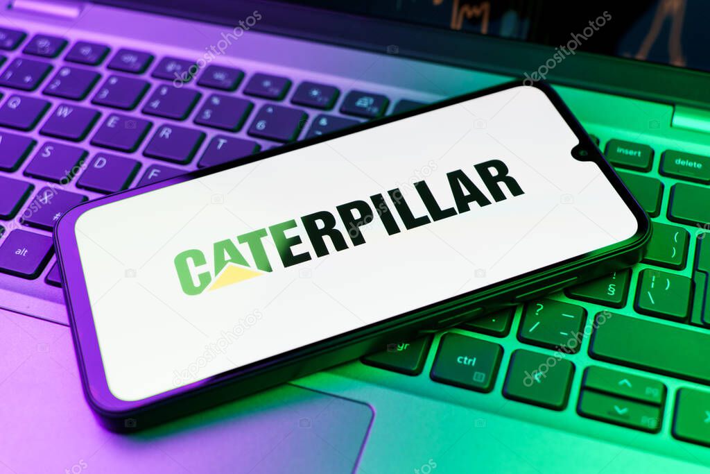 Prague, Czechia - 02 21 2025: Laptop on surface showing Caterpillar logo.