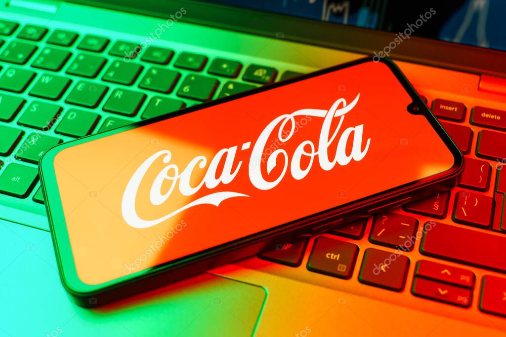 Prague, Czechia - 02 21 2025: Laptop on surface showing Coca-Cola logo.