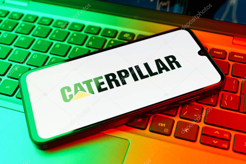 Prague, Czechia - 02 21 2025: Laptop on surface showing Caterpillar logo.