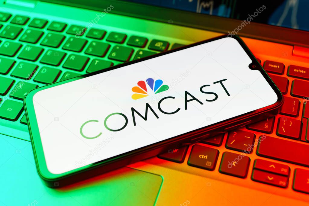 Prague, Czechia - 02 21 2025: Laptop on surface showing Comcast logo.