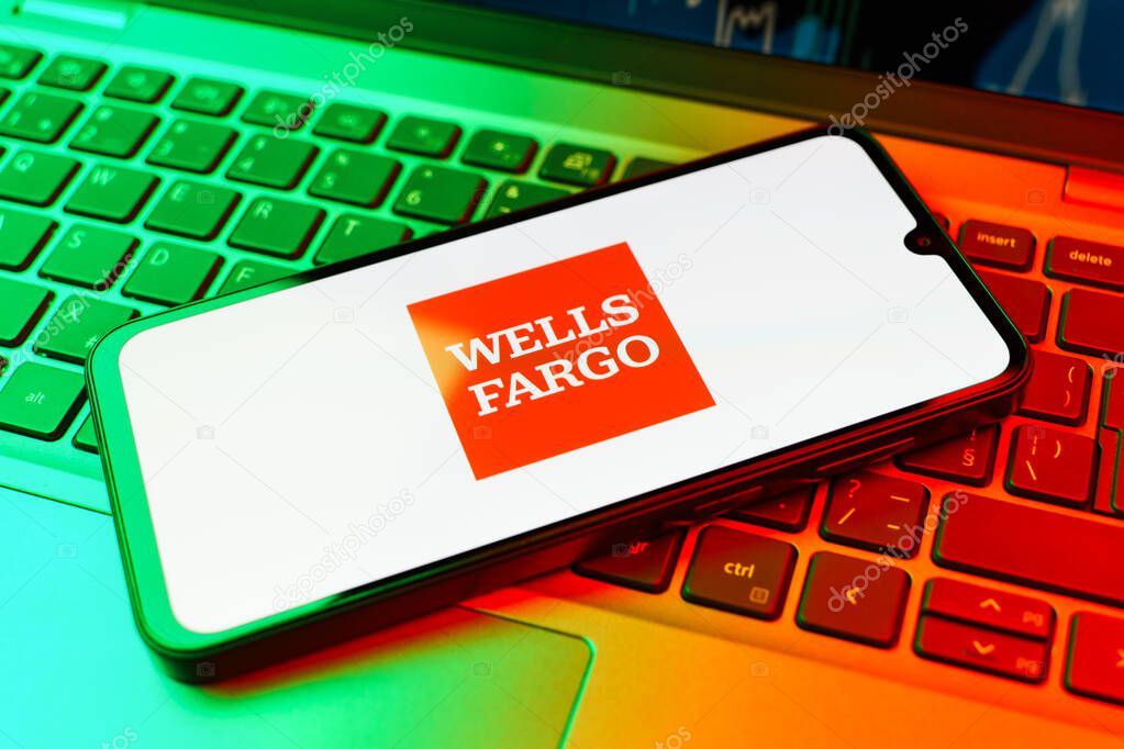 Prague, Czechia - 02 21 2025: Laptop on surface showing Wells Fargo logo.