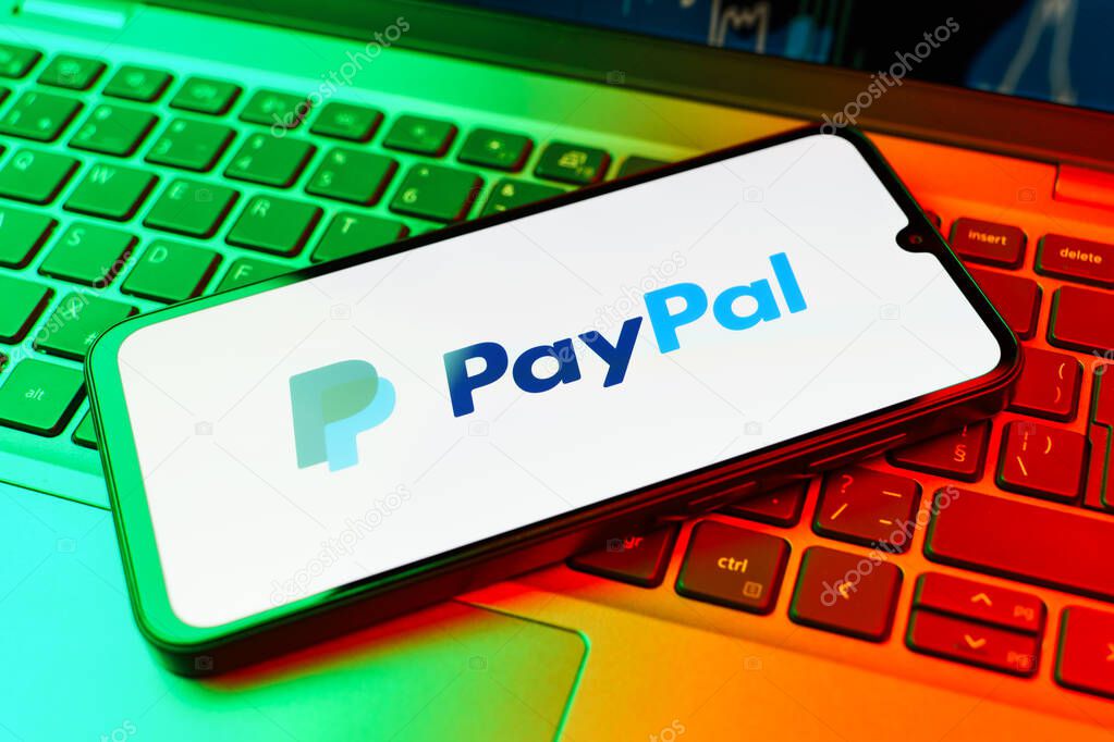 Prague, Czechia - 02 21 2025: Laptop on surface showing PayPal logo.