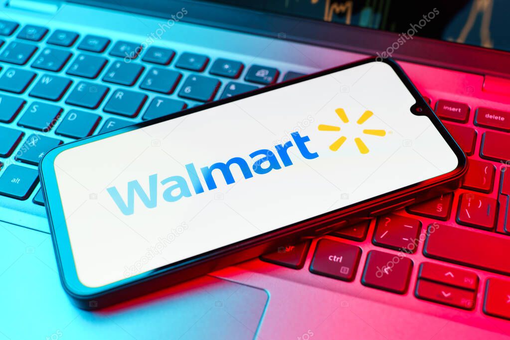 Prague, Czechia - 02 21 2025: Laptop on surface showing Walmart logo.