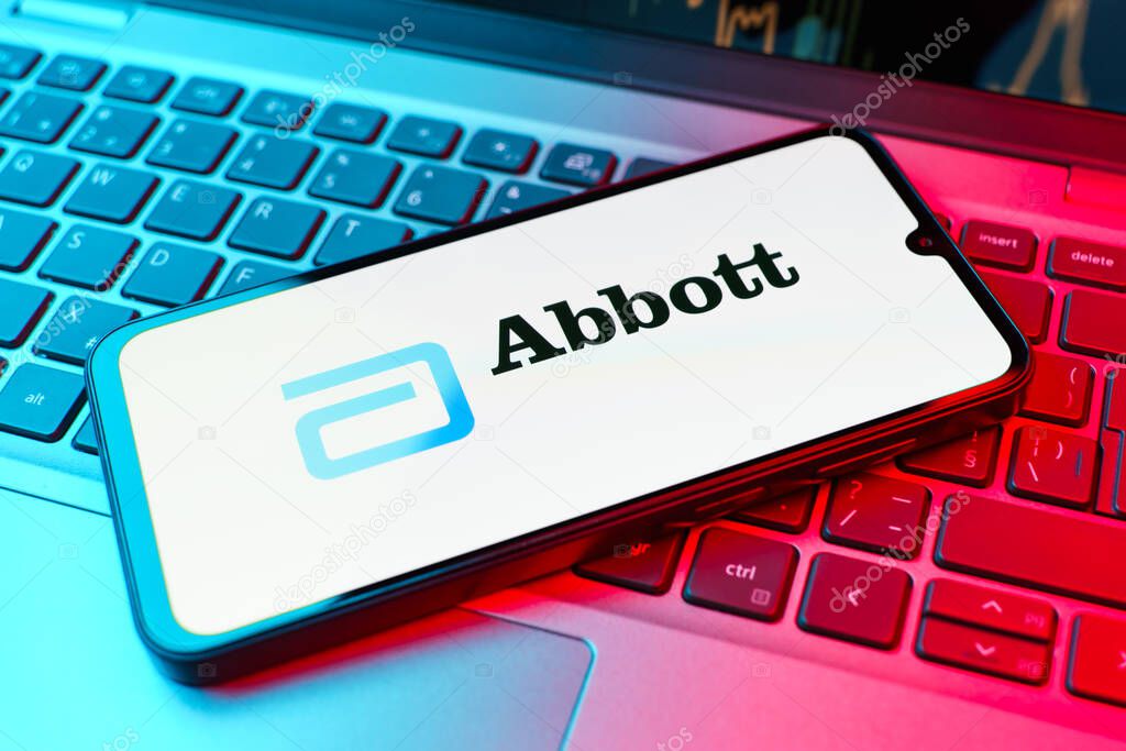 Prague, Czechia - 02 21 2025: Laptop on surface showing Abbott Laboratories logo.