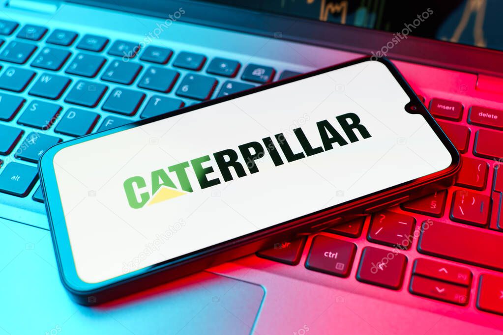 Prague, Czechia - 02 21 2025: Laptop on surface showing Caterpillar logo.