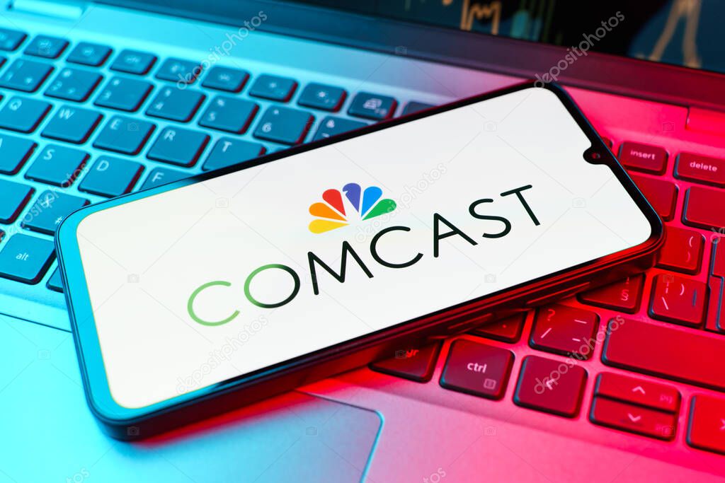 Prague, Czechia - 02 21 2025: Laptop on surface showing Comcast logo.