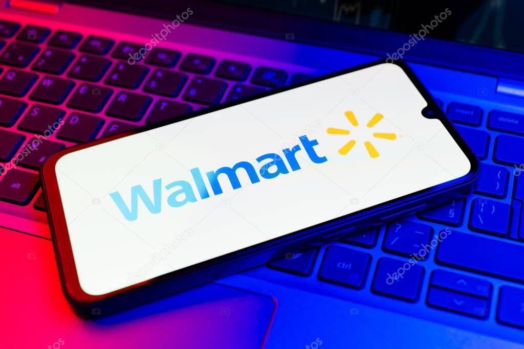 Prague, Czechia - 02 21 2025: Laptop on surface showing Walmart logo.