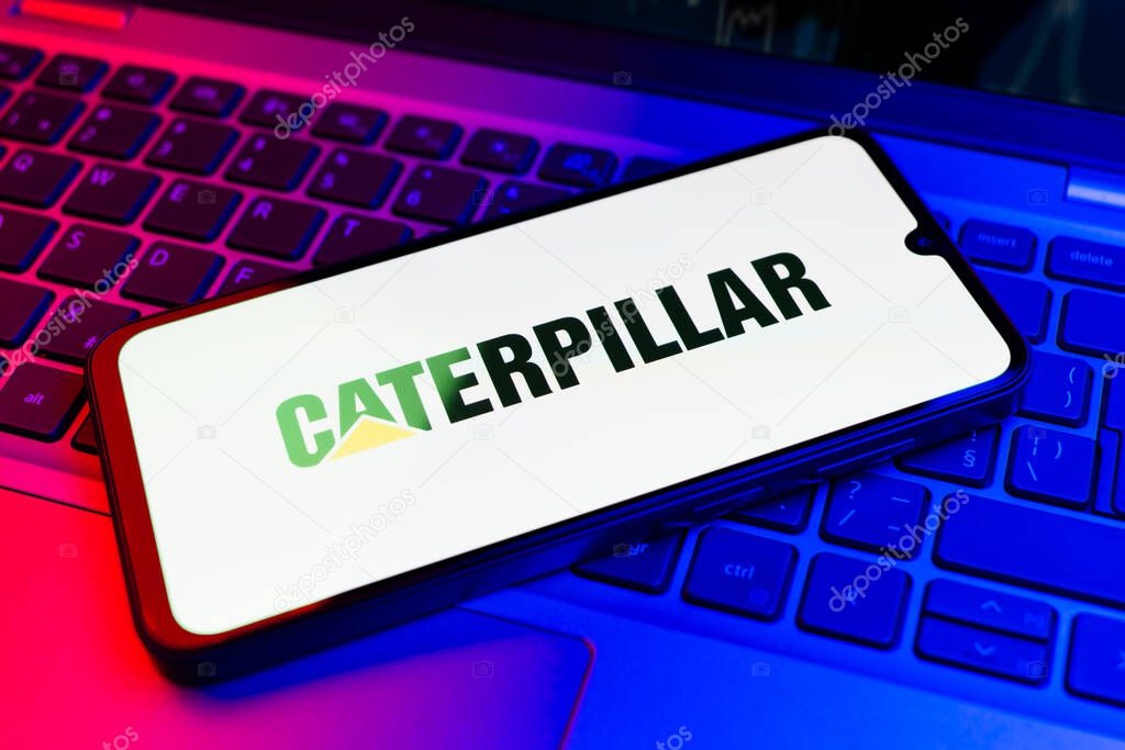 Prague, Czechia - 02 21 2025: Laptop on surface showing Caterpillar logo.