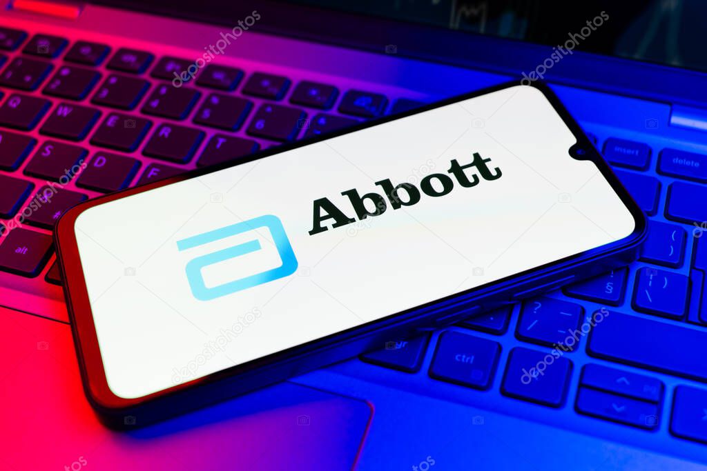Prague, Czechia - 02 21 2025: Laptop on surface showing Abbott Laboratories logo.