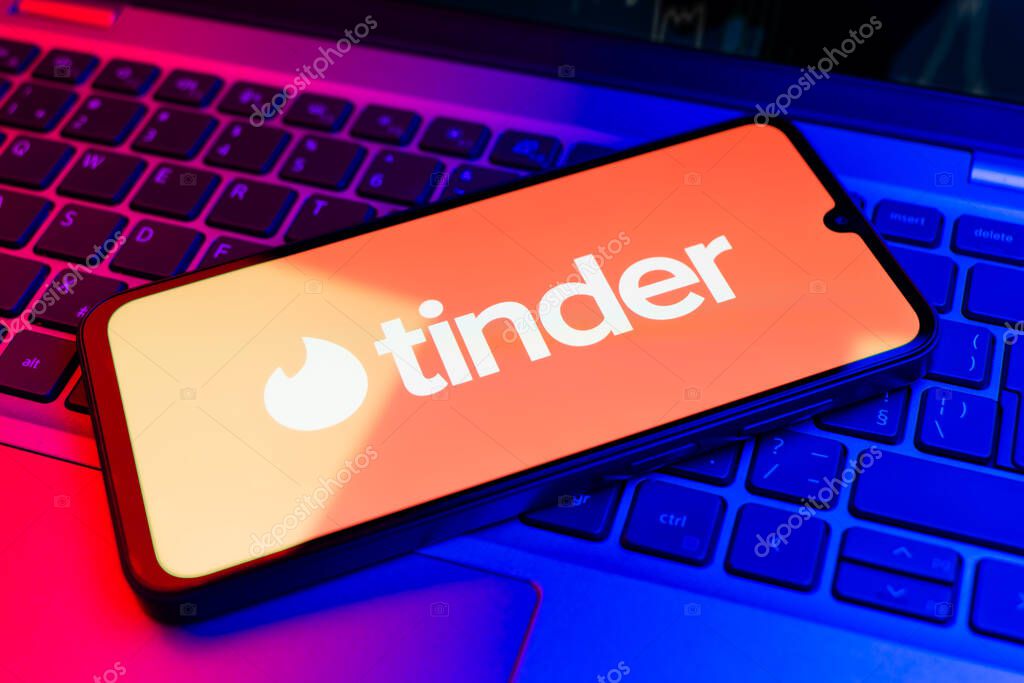 Prague, Czechia - 02 21 2025: Laptop on surface showing Tinder logo.