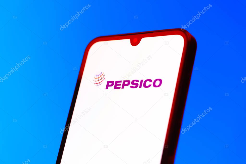 Prague, Czechia - 10 21 2024: Smartphone on surface showing Pepsico logo.