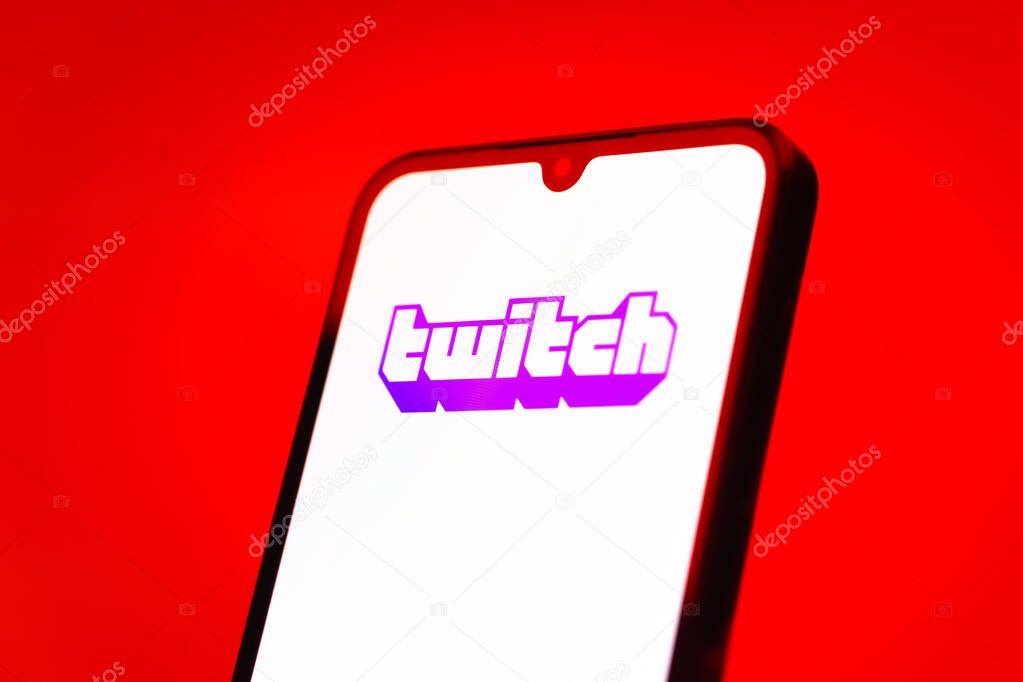 Prague, Czechia - 10 21 2024: Smartphone on surface showing Twitch logo.