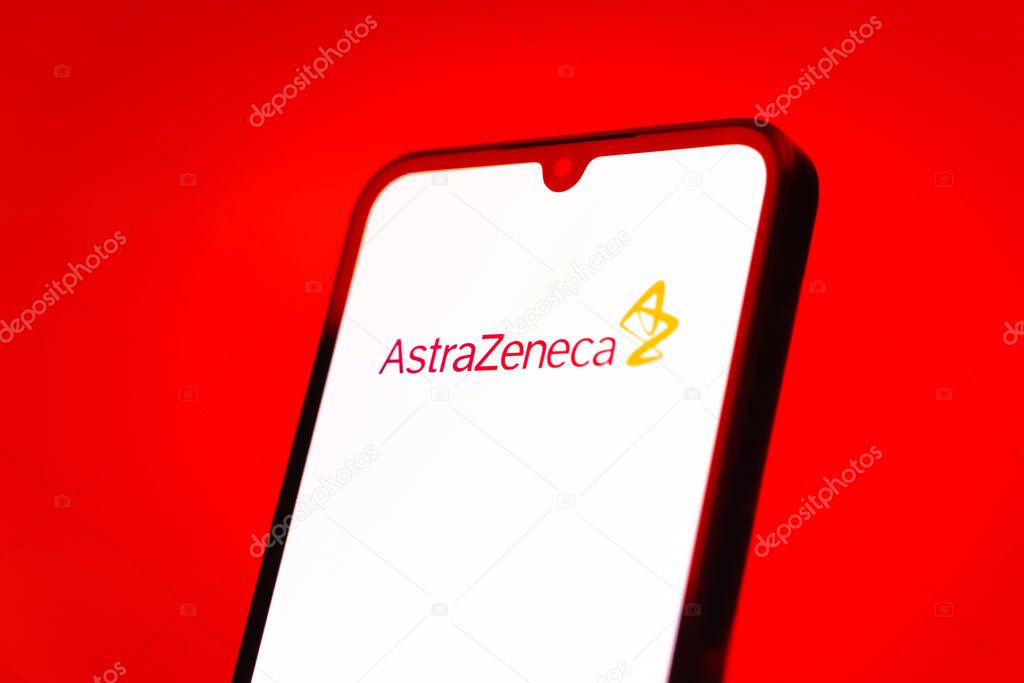 Prague, Czechia - 10 21 2024: Smartphone on surface showing AstraZeneca logo.