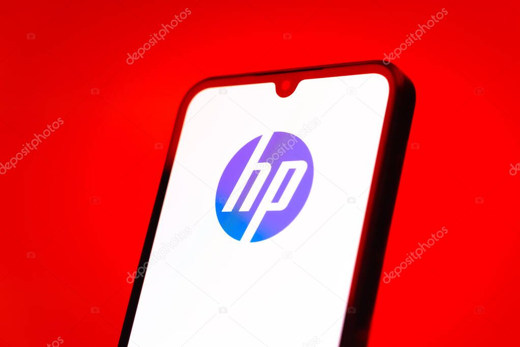 Prague, Czechia - 10 21 2024: Smartphone on surface showing Hewlett-Packard logo.