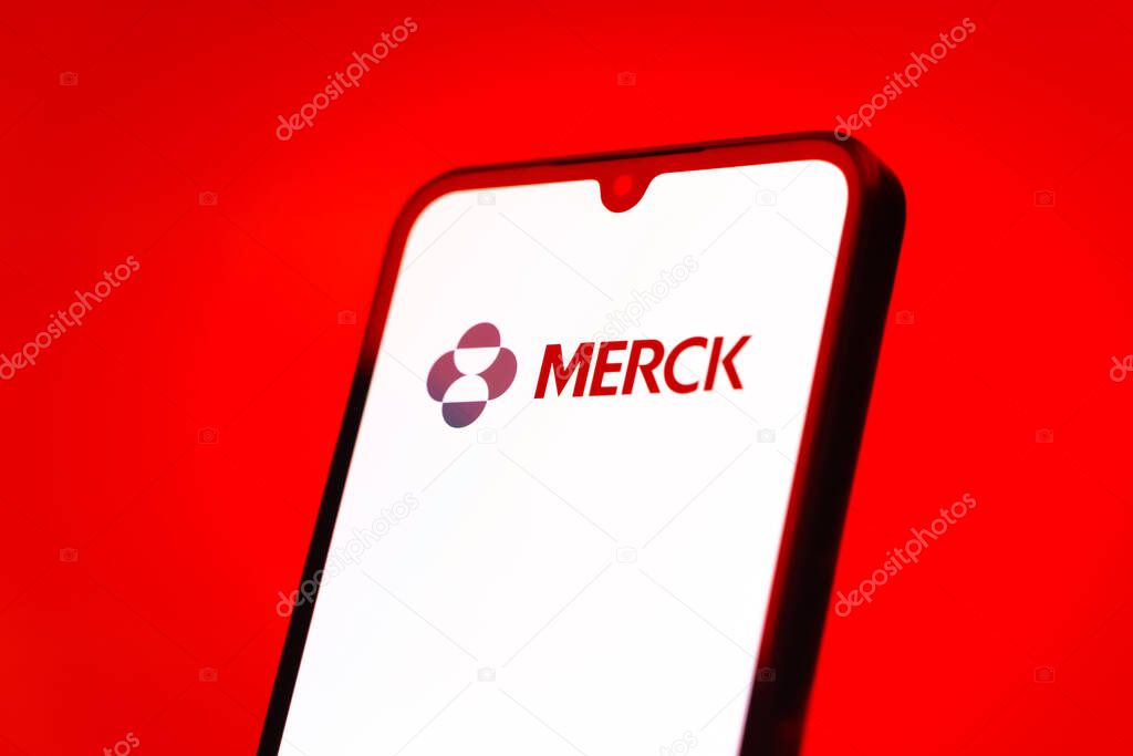 Prague, Czechia - 10 21 2024: Smartphone on surface showing Merck logo.
