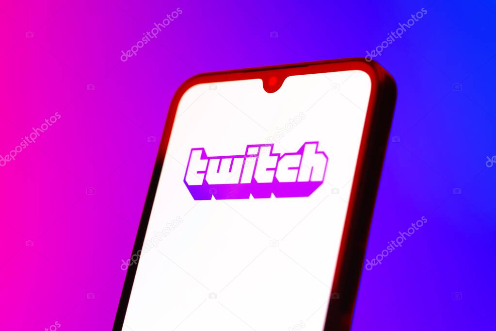 Prague, Czechia - 10 21 2024: Smartphone on surface showing Twitch logo.