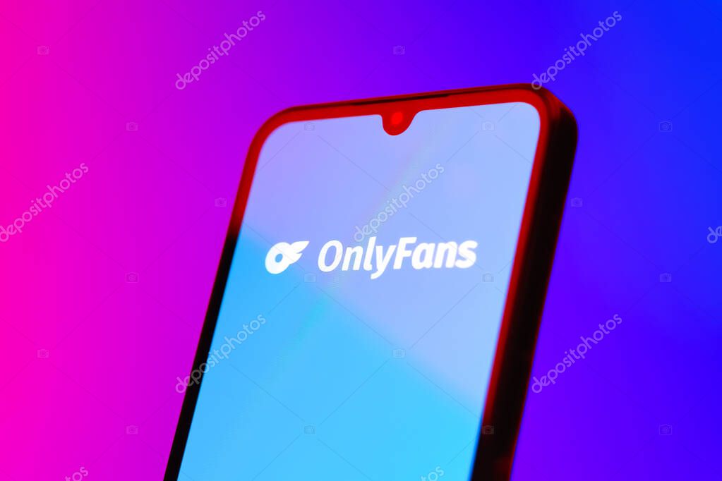 Prague, Czechia - 10 21 2024: Smartphone on surface showing OnlyFans logo.