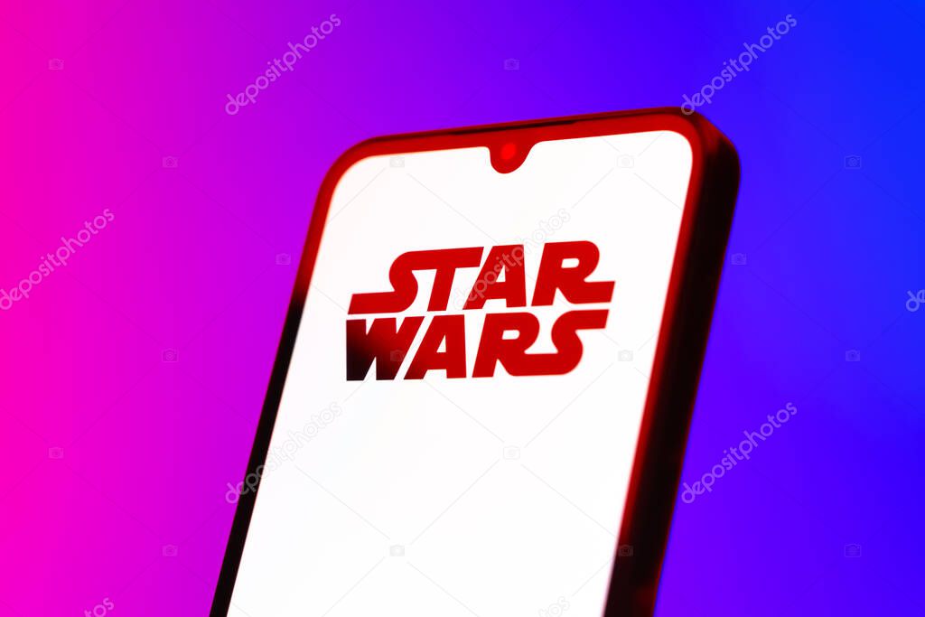 Prague, Czechia - 10 21 2024: Smartphone on surface showing Star Wars logo.