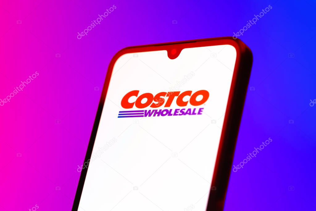 Prague, Czechia - 10 21 2024: Smartphone on surface showing Costco logo.