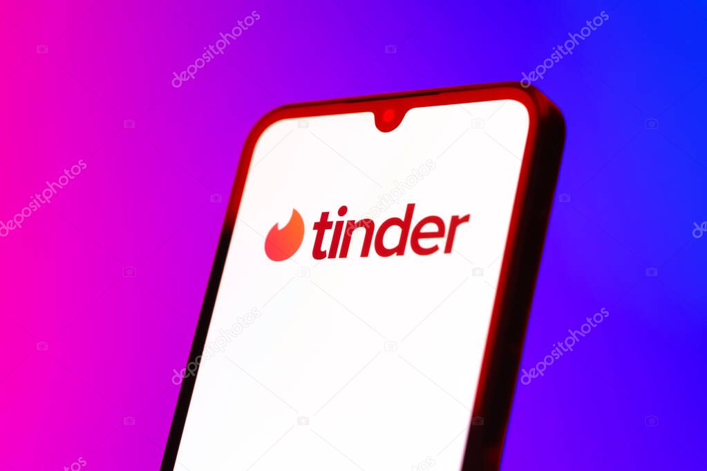 Prague, Czechia - 10 21 2024: Smartphone on surface showing Tinder logo.